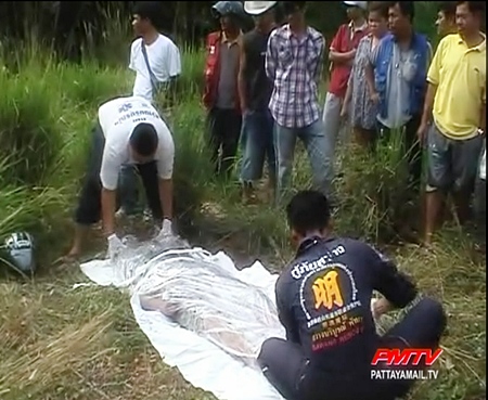 : The dead mans body is removed by paramedics.